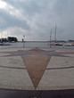 compass from colored stones in a pavement