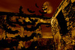 happy halloween. bats are flying over the old ruin