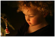 child at christmas tree
