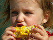 Photo: girl eating corn on the cob girl eating corn on the cob