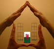 hands holding welsh house hands holding welsh house