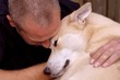 man hugging his dog man hugging his dog