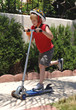 boy riding scooter