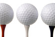 three golf balls on tees