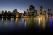 city skyline at dusk by river