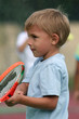 boy holding his racquet