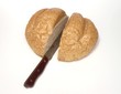cut whole wheat bread loaf with knife