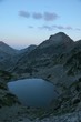 mountain peak with lake at sunset