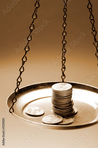 money on a balance scale