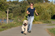 Photo: woman running with her dog woman running with her dog