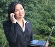 business woman with laptop and phone
