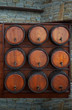 wine barrels stand  on the stone wall