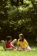 young couple have picnic in park