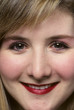 Photo: tight portrait of woman smiling at camera tight portrait of woman smiling at camera