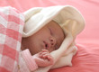 baby sleeping in red