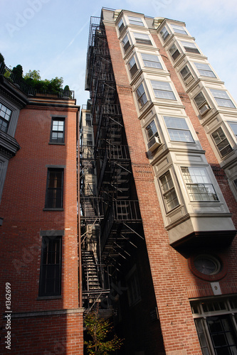 Photo: tall building with fire escape and bay windows full color tall building with fire escape and bay windows full color