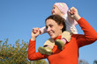 baby on mother shoulders
