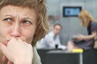 sad woman with couple in background