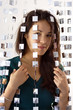 Photo: woman behind mirrored beads woman behind mirrored beads