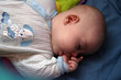 baby sucking her finger