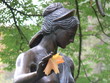 statue of an ancient with autumn leaf