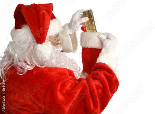 Photo: santa stuffs stocking santa stuffs stocking