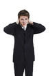 man plugging his ears