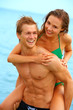 a young couple having fun on the beach