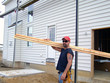 construction worker - carrying lumber construction worker - carrying lumber