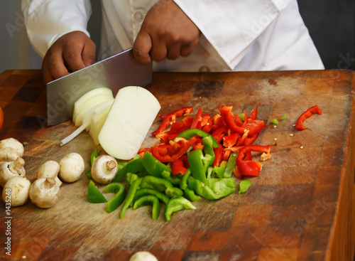 chef cutting vegetables close up