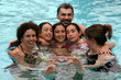 big family in the pool
