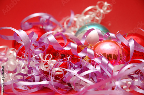Photo: various christmas decorations on red background various christmas decorations on red background