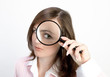 young woman with magnifying glass