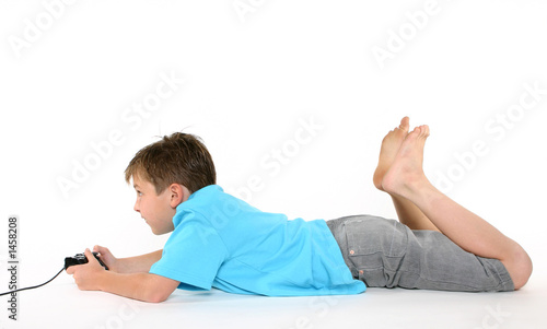 Photo: boy using console playing games boy using console playing games