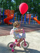 girl with red ballon riding bicycle girl with red ballon riding bicycle