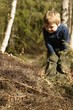 boy and ant-hill