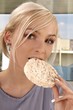 woman eating rice cracker