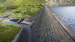 reservoir and dam with high water level overlookin reservoir and dam with high water level overlookin