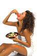 beautiful brunette girl eating fresh salad