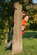 family of three hide tree