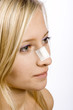 Foto: face of young woman with sticking plaster on nose face of young woman with sticking plaster on nose