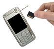 mobile phone and hand with memory card