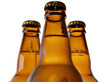 upper part of three beer bottles