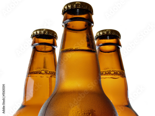 upper part of three beer bottles
