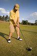 man about to hit golf ball