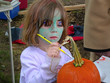 girl painting pumpkin girl painting pumpkin