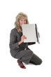 woman frustrated with laptop biting it