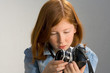 Photo: girl with old slr photo camera girl with old slr photo camera