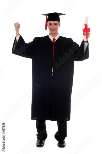 male graduate smiling holding a degree