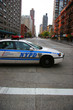 Photo: police car crossing empty city street police car crossing empty city street